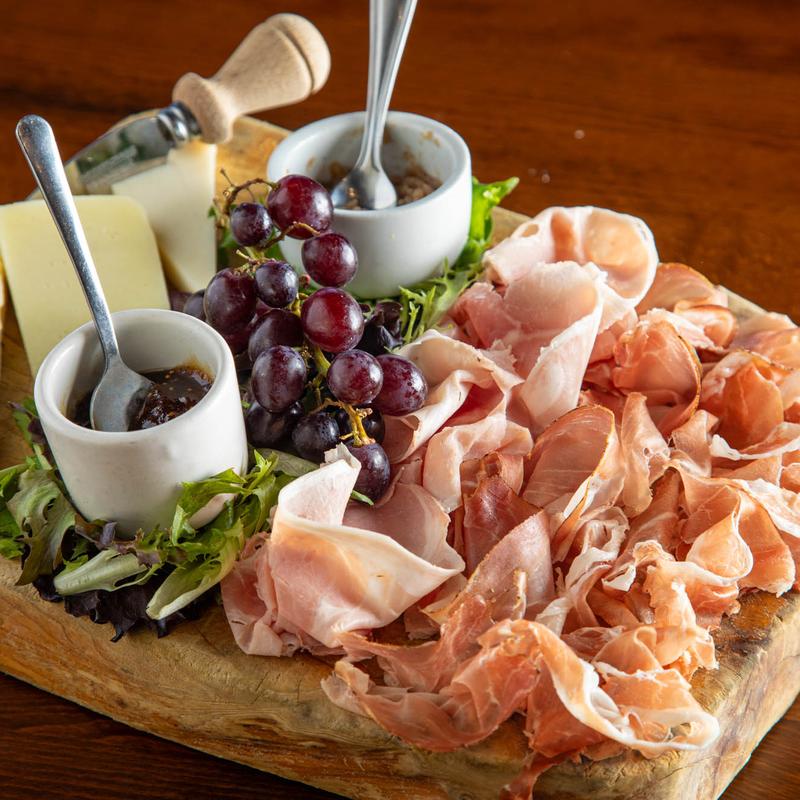 The Italian Barrel signature dishes Prosciutto di ParmaVeal Ravioli with Truffle SauceTiramisu
